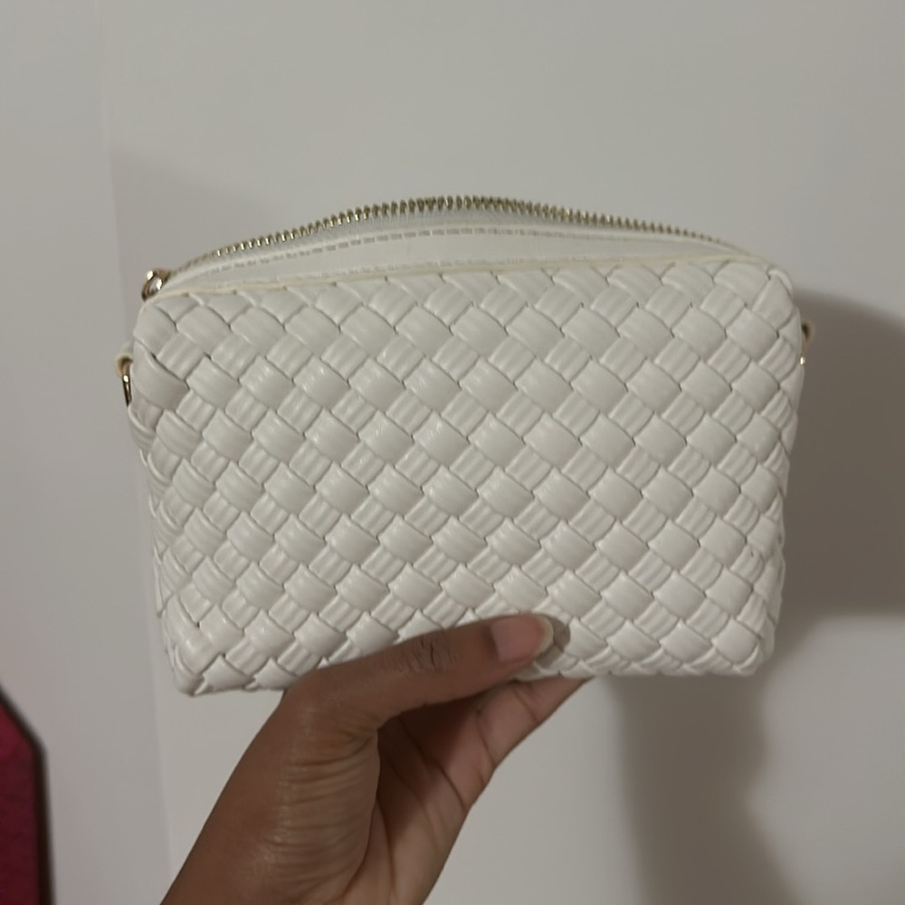 White woven crossbody purse with gold hardware and two straps